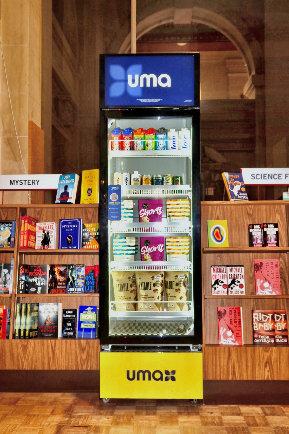 Top of the Uma cabinet showing the illuminated Uma logo screen